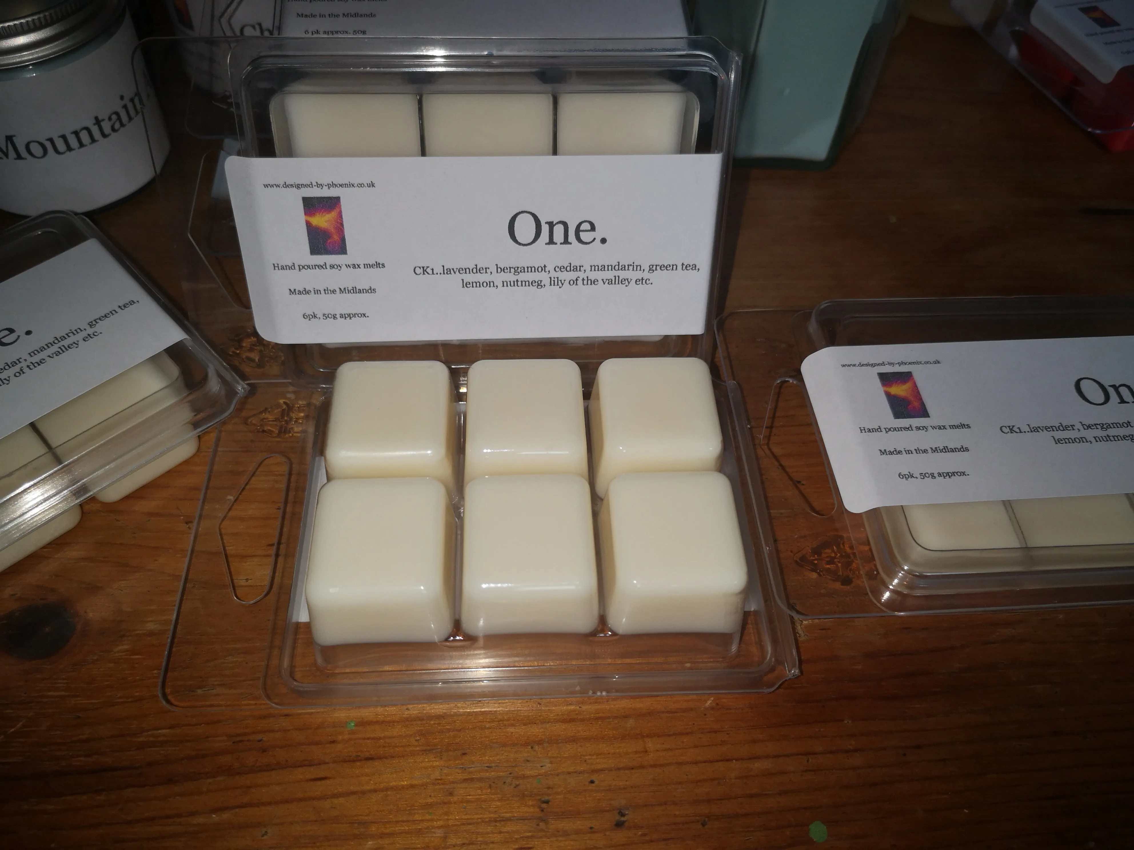 One.  (inspired by CK1 fragrance) hand poured soy wax melts & candles.